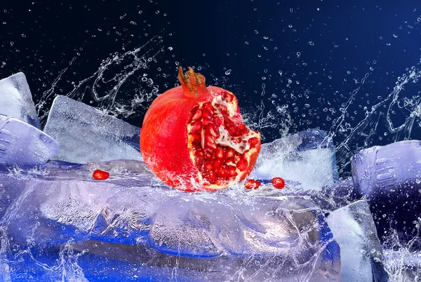 Water drops around red fruit on the ice — Stock Photo, Image