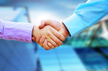 Shaking hands of two business clipart