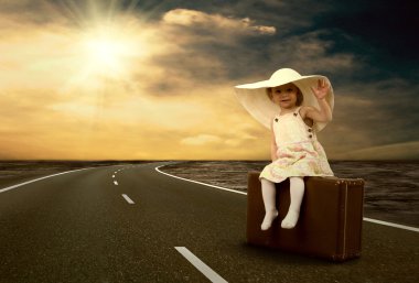 Little girl waiting on the road with her vintage baggage clipart