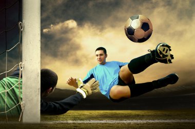 Shoot of football player and goalkeeper clipart