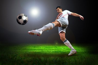 Happiness football player after goal on the field of stadium wit clipart