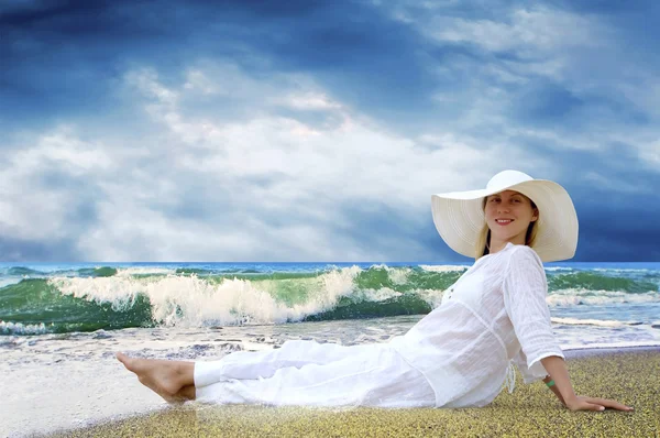 stock image Young beautiful women in the white on the beach