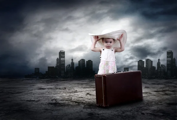 Little girl waiting on the road with her vintage baggage — Stock Photo, Image
