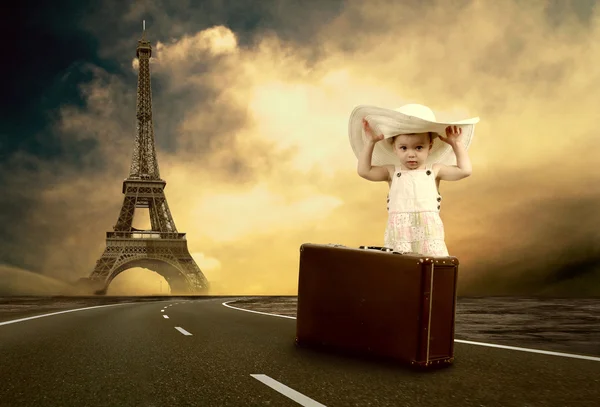 Little girl waiting on the road with her vintage baggage — Stock Photo, Image