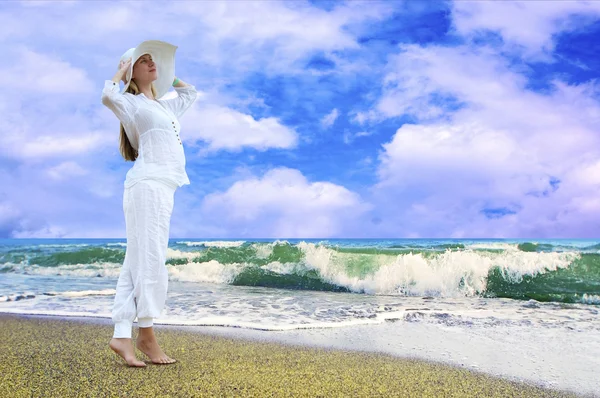 stock image Young beautiful women in the white on the beach