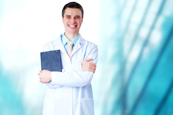 Χαμογελώντας γιατρός με το στηθοσκόπιο για τα νοσοκομεία backgro — Φωτογραφία Αρχείου