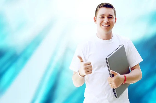 Glad ung eller student med laptop och telefon på verksamheten — Stockfoto