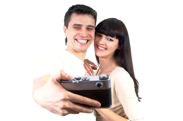Jovem casal de beleza com câmera fotográfica isolada no backgrou branco — Fotografia de Stock