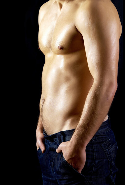 Naked muscular male model in jeans