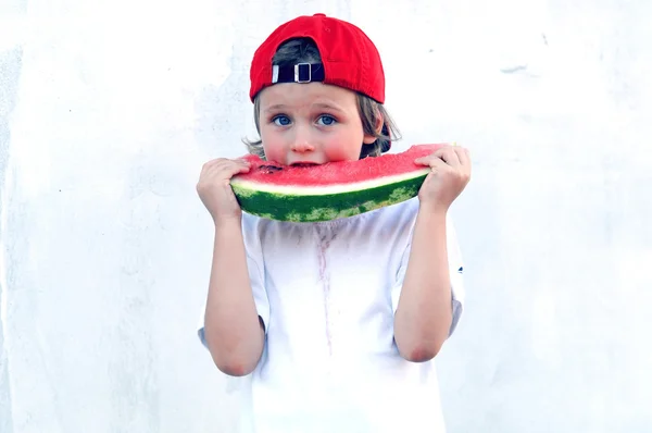 stock image Child with part of watermelon, isolated on the white background