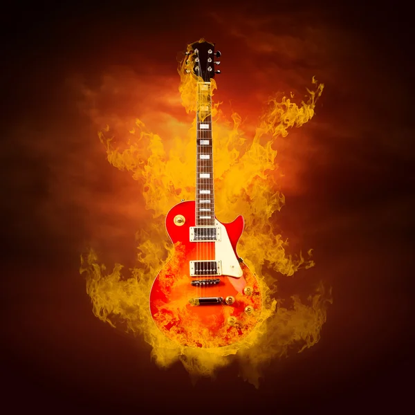 Rock guita v plameny ohně — Stock fotografie