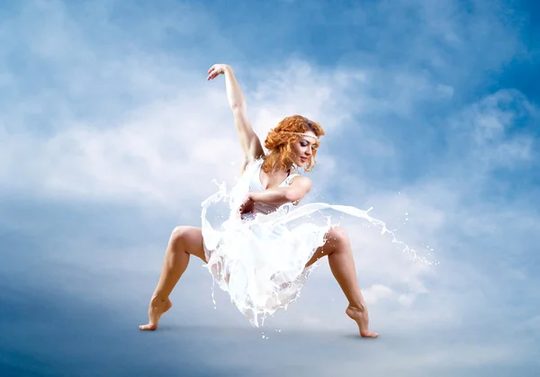 Jump of ballerina with dress of milk — Stock Photo, Image