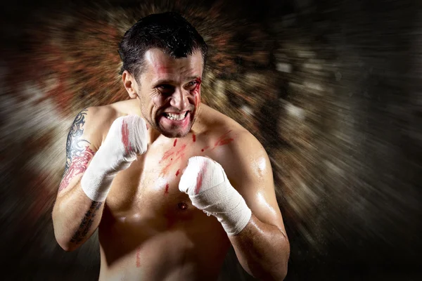 Aggressive boxer with blood on the face Royalty Free Stock Photos