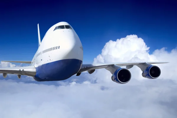 Samolot w locie na niebo z chmurami Obrazek Stockowy
