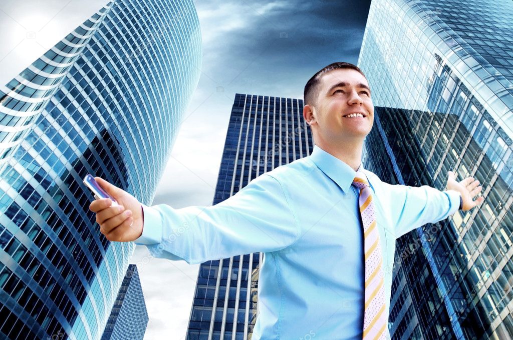 Hapiness Businessman standing on the business background