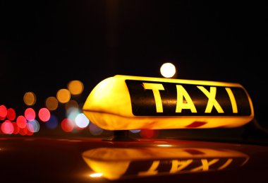 Taxi sign at night clipart