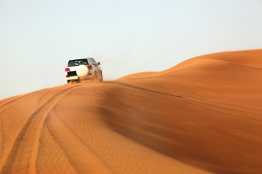 Dune bashing in the desert clipart