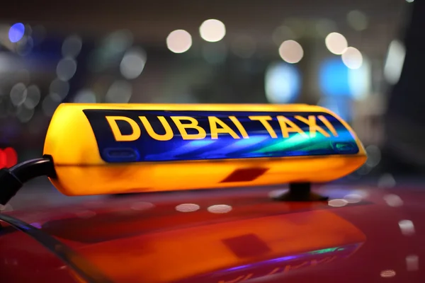 Dubai taxi sign at night — Stock Photo, Image