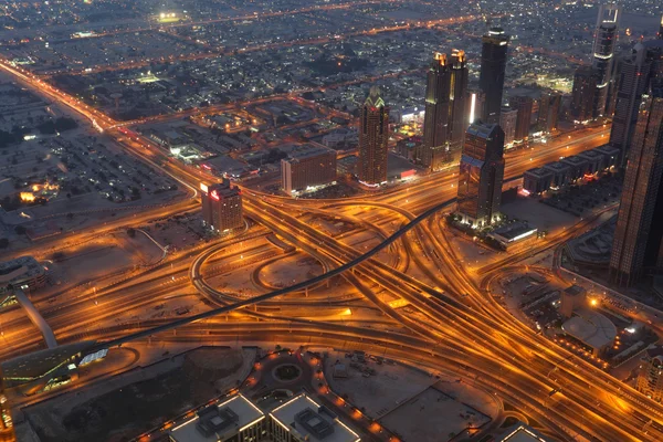Aerial view of a highway junction at night. Dubai — Stock Photo, Image
