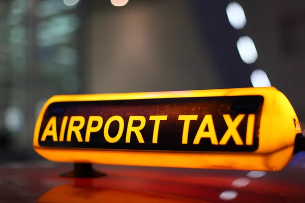 Vliegveld taxi teken — Stockfoto