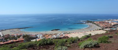 Aerial view over Playa de las Vistas in Los Cristianos, Tenerife Spain clipart