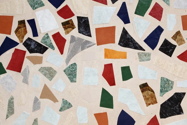 Colorful wall with broken fragments of tiles — Stock Photo, Image