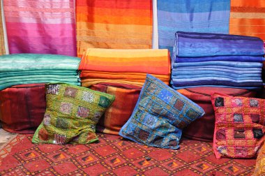 Colorful fabrics for sale in Fes, Morocco clipart