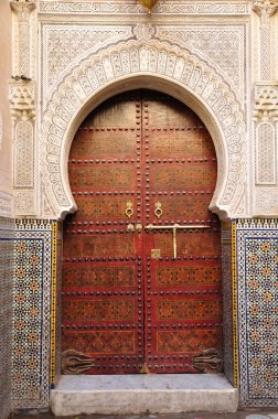 Decorated door in the medina of Fes, Morocco clipart