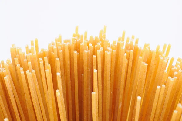 Wholemeal spaghetti background — Stock Photo, Image