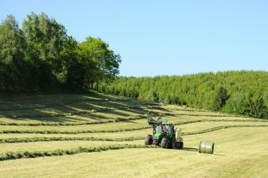 Tractor in field clipart