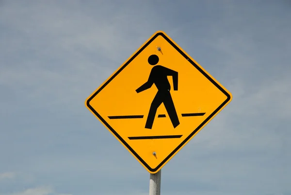 Crosswalk road sign against blue sky — Stock Photo, Image