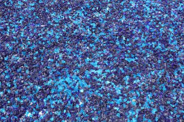 Blue crushed glass shards background clipart