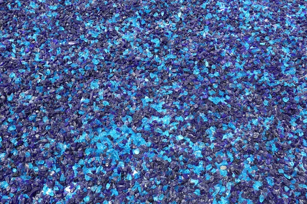 Blue crushed glass shards background