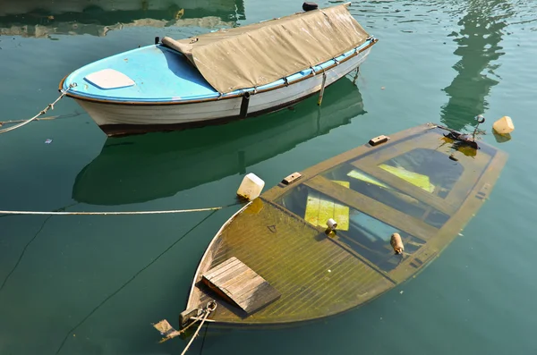 stock image Two boats on berth, one is sinking