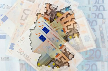 Outline map of Germany with transparent euro banknotes in backgr clipart