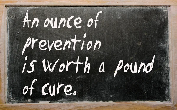 "An ounce of prevention is worth a pound of cure" written on a b — Stock Photo, Image
