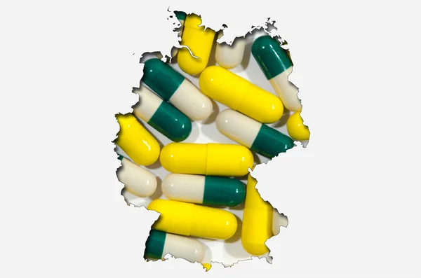 Konturkarta över Tyskland med piller i bakgrunden — Stockfoto
