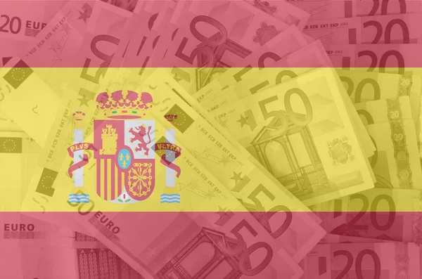 Bandiera della Spagna con sullo sfondo banconote in euro trasparenti — Foto Stock