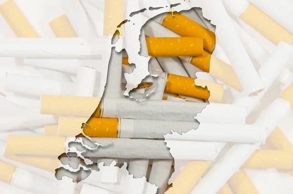 Outline map of Netherlands with cigarettes in background — Stock Photo, Image