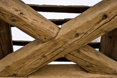 Wooden cross in old roof clipart