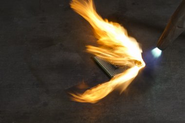 Burning a computer chip with welding torch clipart