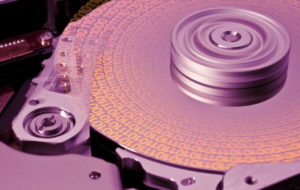 Hard disk in motion with binary data -aab- — Stock Photo, Image