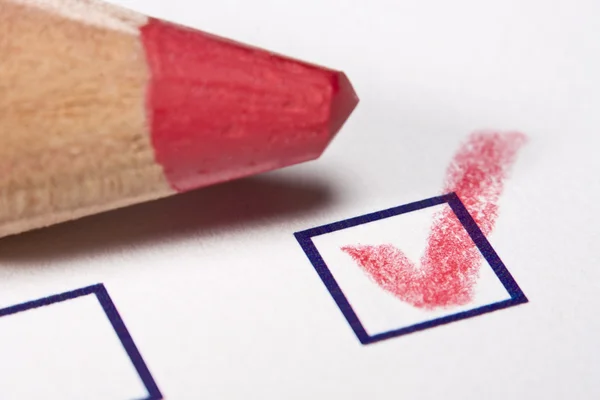 Red pencil - checked — Stock Photo, Image