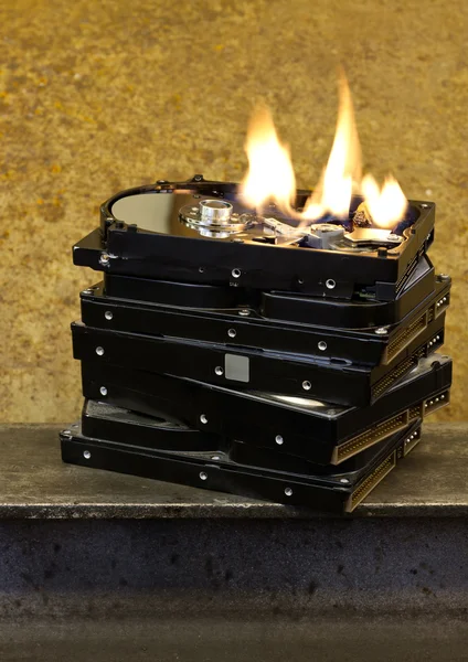 Burning stack of hard drives — Stock Photo, Image