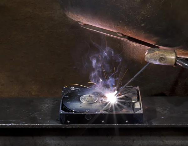 Repairing a defect hard disk with welding apparatus — Stock Photo, Image