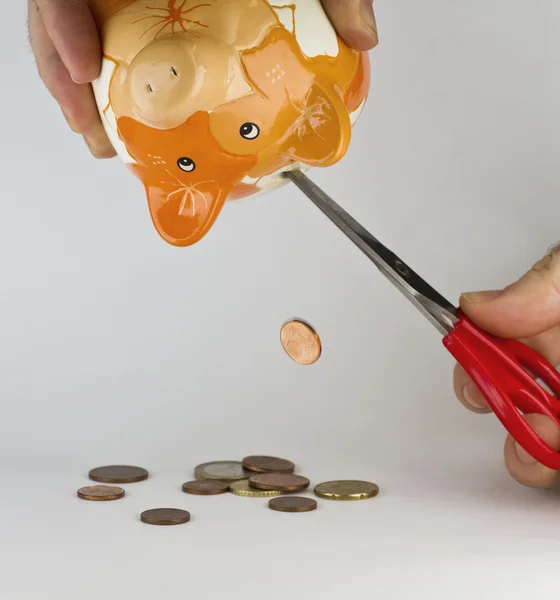 stock image Getting money out of piggybank