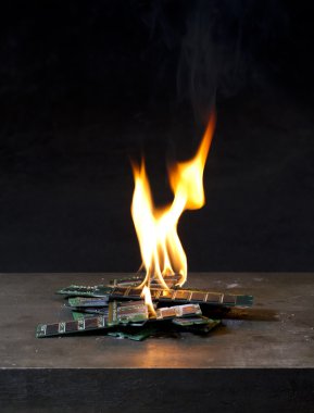 Burning ram in black background clipart