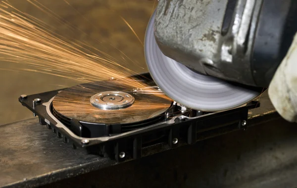 Working with angular grinder on open hard drive — Stock Photo, Image