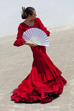 Traditional Woman Spanish Flamenco Dancer In Red Dress With Fan clipart