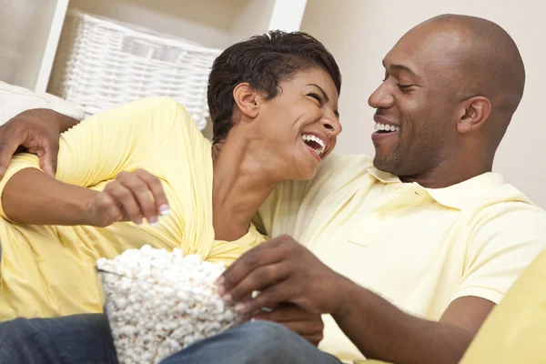 Happy African American Couple Eating Popcorn Watching Movie at H — Stock Photo, Image